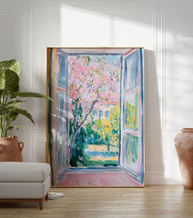 Impressionist Window View Poster showing a vibrant pink blossom tree in a lush green garden with a building in the background. - Image 3