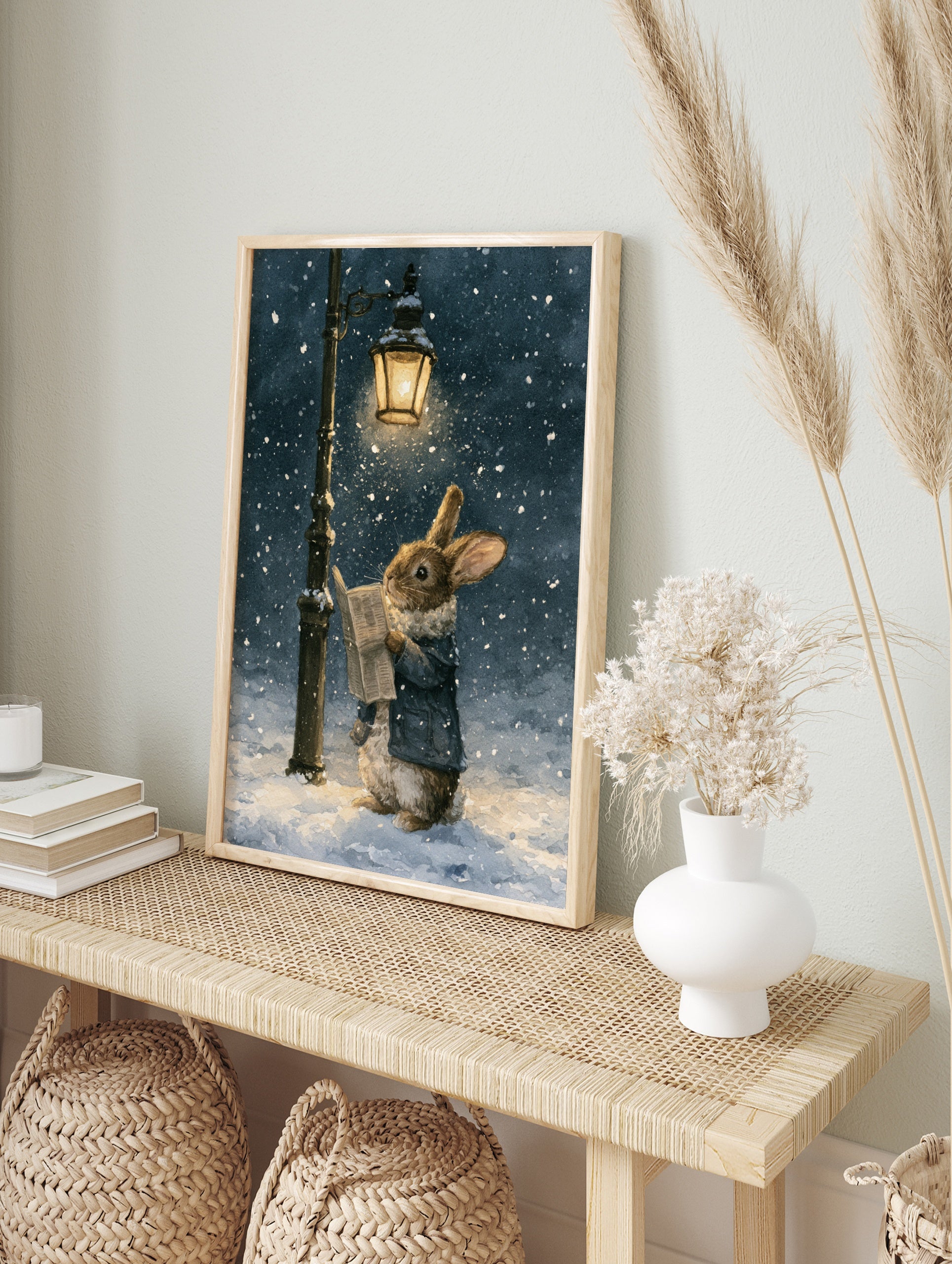 Watercolor illustration of a brown rabbit in a blue coat reading a newspaper under a lit, in an alternate framed mockup