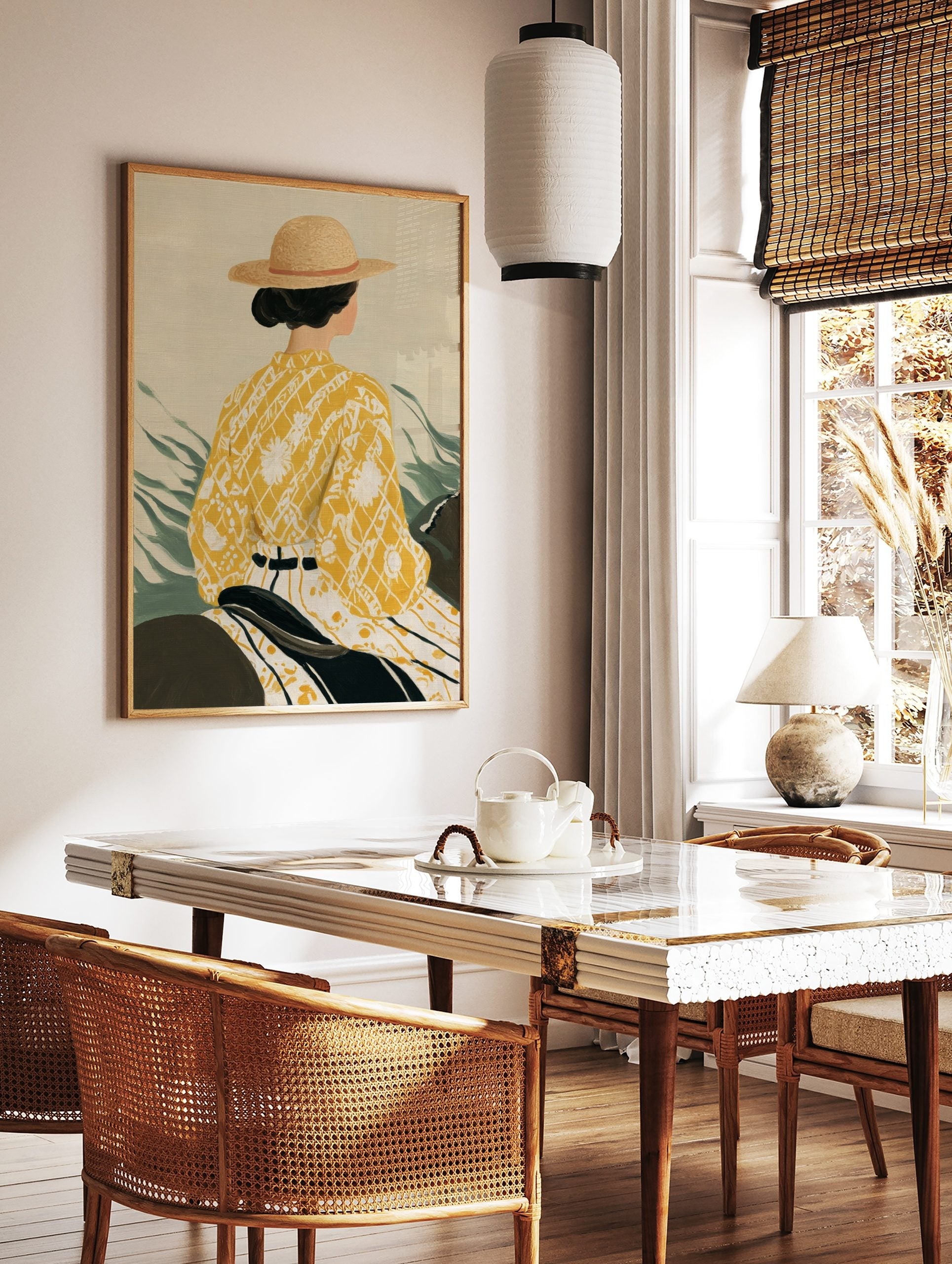 Illustrative art print of a woman in a straw hat and yellow patterned kimono-style top from behind, in a styled room mockup