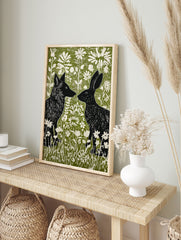 Black fox and rabbit facing each other in a green and white linocut style woodland animal wall art print with flowers. - Image 3