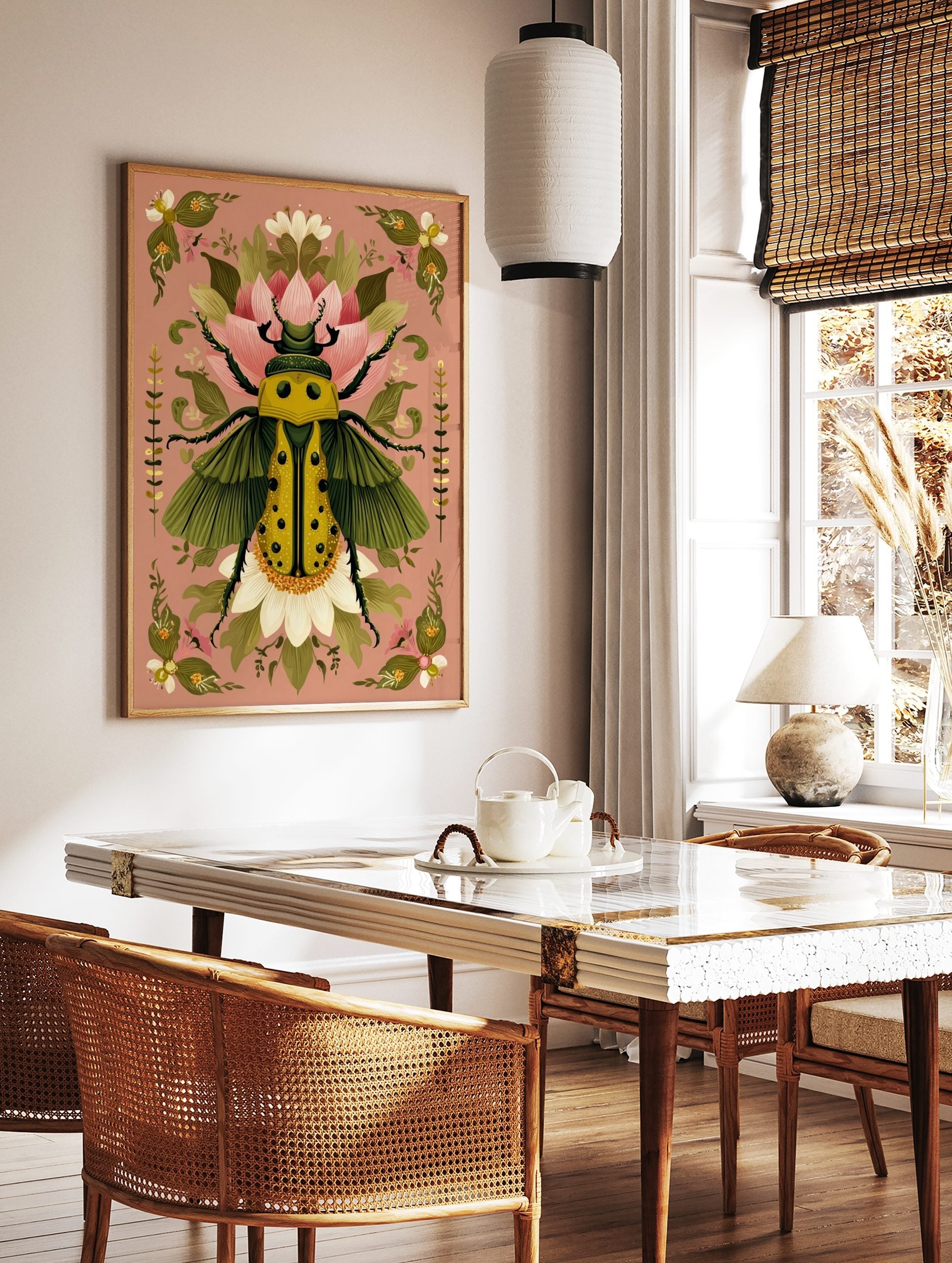 Ornate yellow beetle illustration with green wings and black spots, surrounded by pink and white, in a styled room mockup