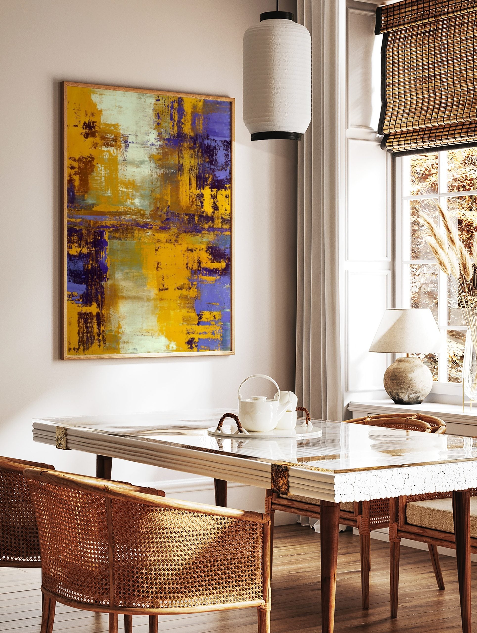 Abstract painting with bold yellow and deep purple textured brushstrokes, accented with white and, in a styled room mockup