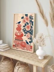 Zen bird and stone wall art print with two blue birds on stacked red stones and a branch of red flowers on peach background. - Image 3