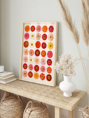 Botanical grid art print featuring thirty colourful zinnia flowers in red, orange, pink, and, in an alternate framed mockup