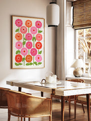 Botanical zinnia flower illustration in pink, orange, and red with green stems on a cream background, in a styled room mockup